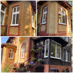 RENOWATOR KAROL PRZEŹDZIĘK - Odnowiona elewacja budynku z ceglaną obudową okien i nowymi białymi oknami, widok na wejście z kwiatami na schodach.