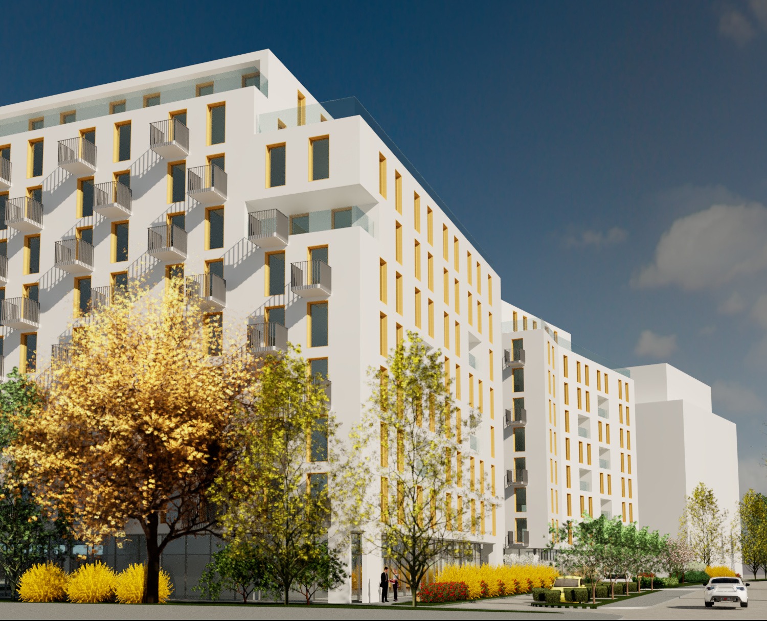 Wizualizacja budynku usługowego z balkonami, żółtymi ramami okiennymi i zielenią miejską w jesiennej scenerii.