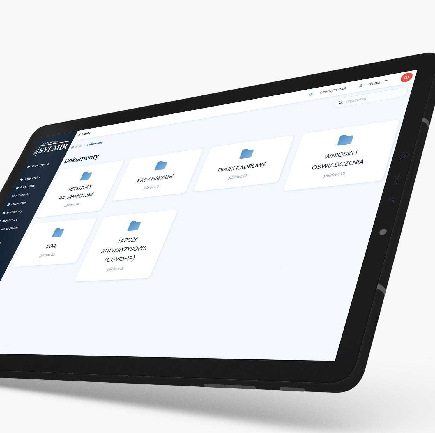 Tablet wyświetlający interfejs strony internetowej z kategoriami dokumentów: Broszury informacyjne, Kasy fiskalne, Druki kadrowe, Wnioski i oświadczenia, Tarcza antykryzysowa (COVID-19).