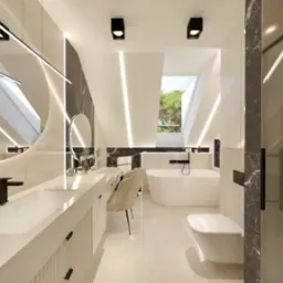 Nowoczesna łazienka na poddaszu z oknem dachowym, białymi meblami, czarnymi akcentami marmuru i okrągłym lustrem z podświetleniem LED.