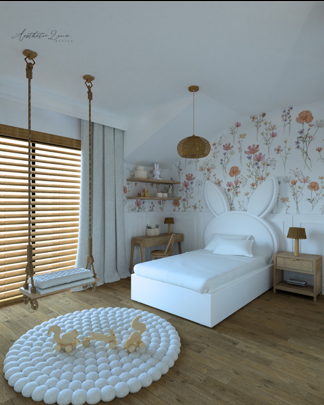 Pokój dziecięcy z białym łóżkiem z zagłówkiem w kształcie króliczych uszu, wiszącą huśtawką linową, okrągłym puszystym dywanem z drewnianymi zabawkami, biurkiem z półkami i kwiecistą tapetą.