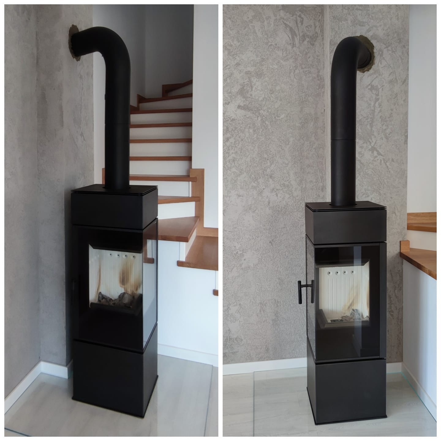 Nowoczesny, czarny kominek wolnostojący z przeszklonym paleniskiem i czarną rurą odprowadzającą dym, zamontowany przy ścianie o fakturze betonu w jasnym wnętrzu. Widoczne schody w tle.