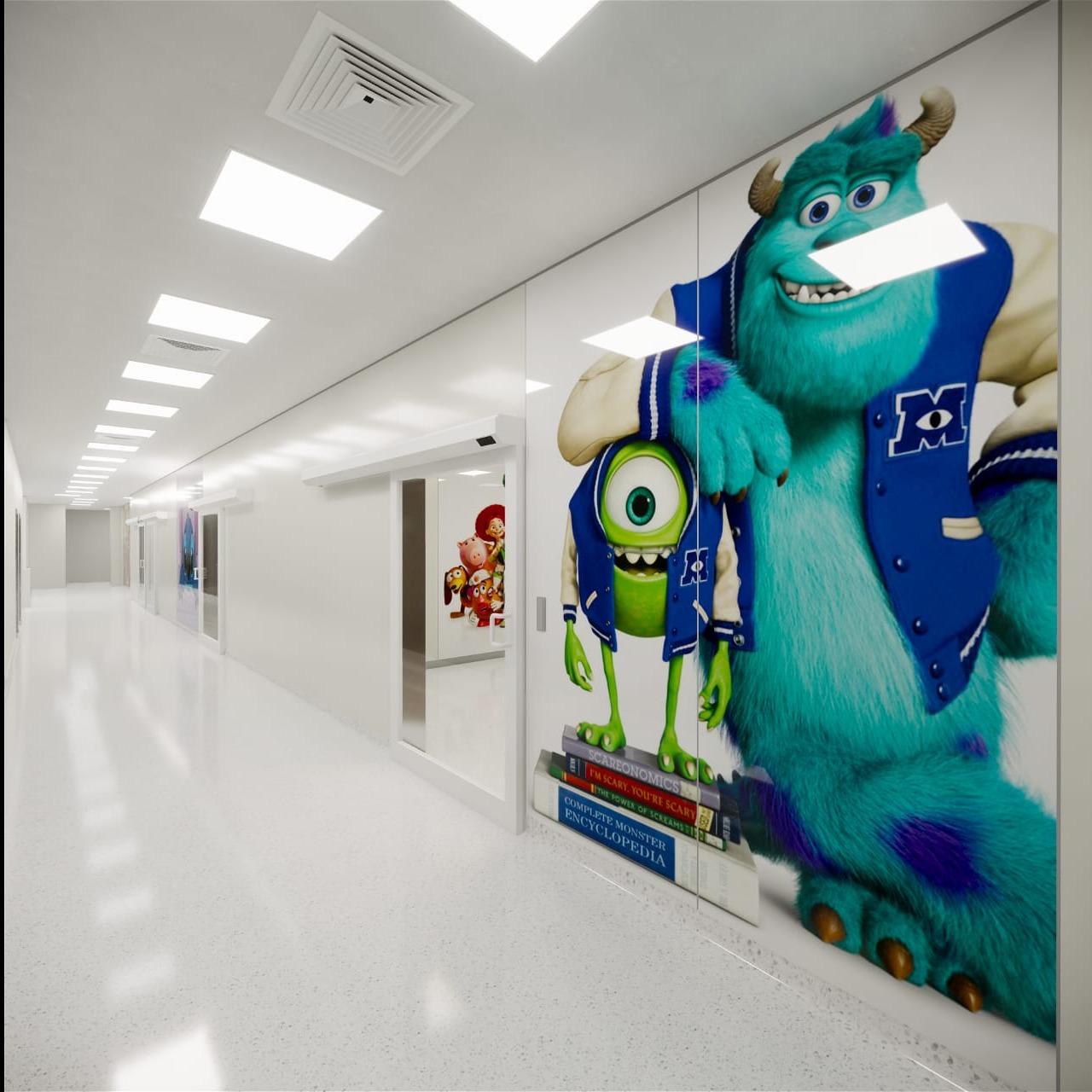 Długi, jasny korytarz z białymi ścianami i podłogą, na których naklejone są postacie z bajki Monsters, Inc.: Sully i Mike Wazowski, stojący na książkach.