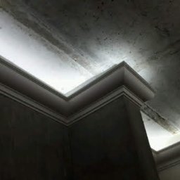 Dmytro Marynchenko - Narożnik sufitu z dekoracyjną listwą oświetleniową LED, surowy tynk na ścianach i suficie, widoczne ślady po szpachlowaniu, stan surowy.