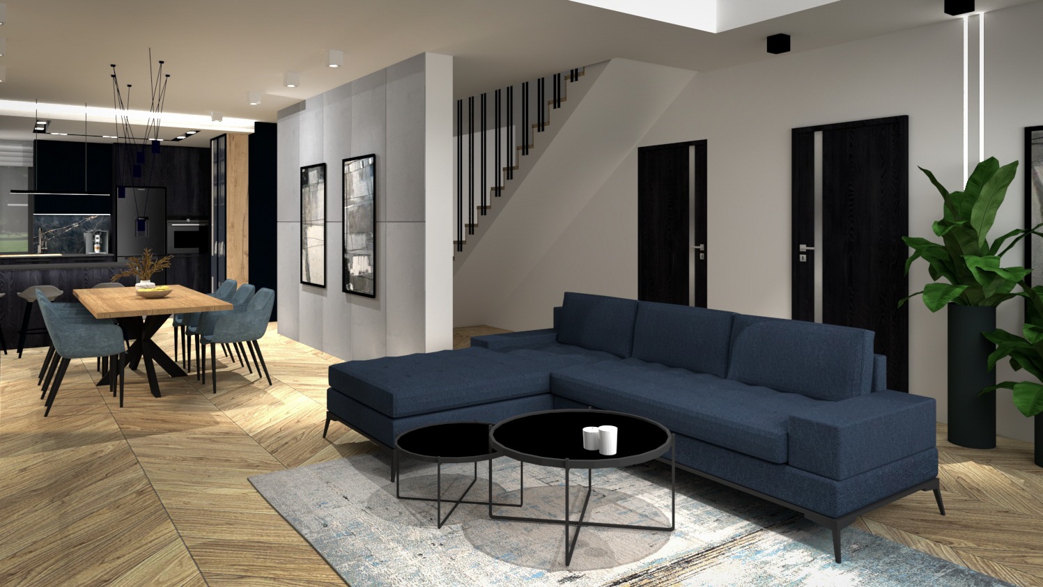 Wizualizacja przestronnego salonu z aneksem kuchennym, z granatową sofą narożną, okrągłymi stolikami kawowymi na wzorzystym dywanie, drewnianym stołem z krzesłami i czarną zabudową kuchenną w tle.