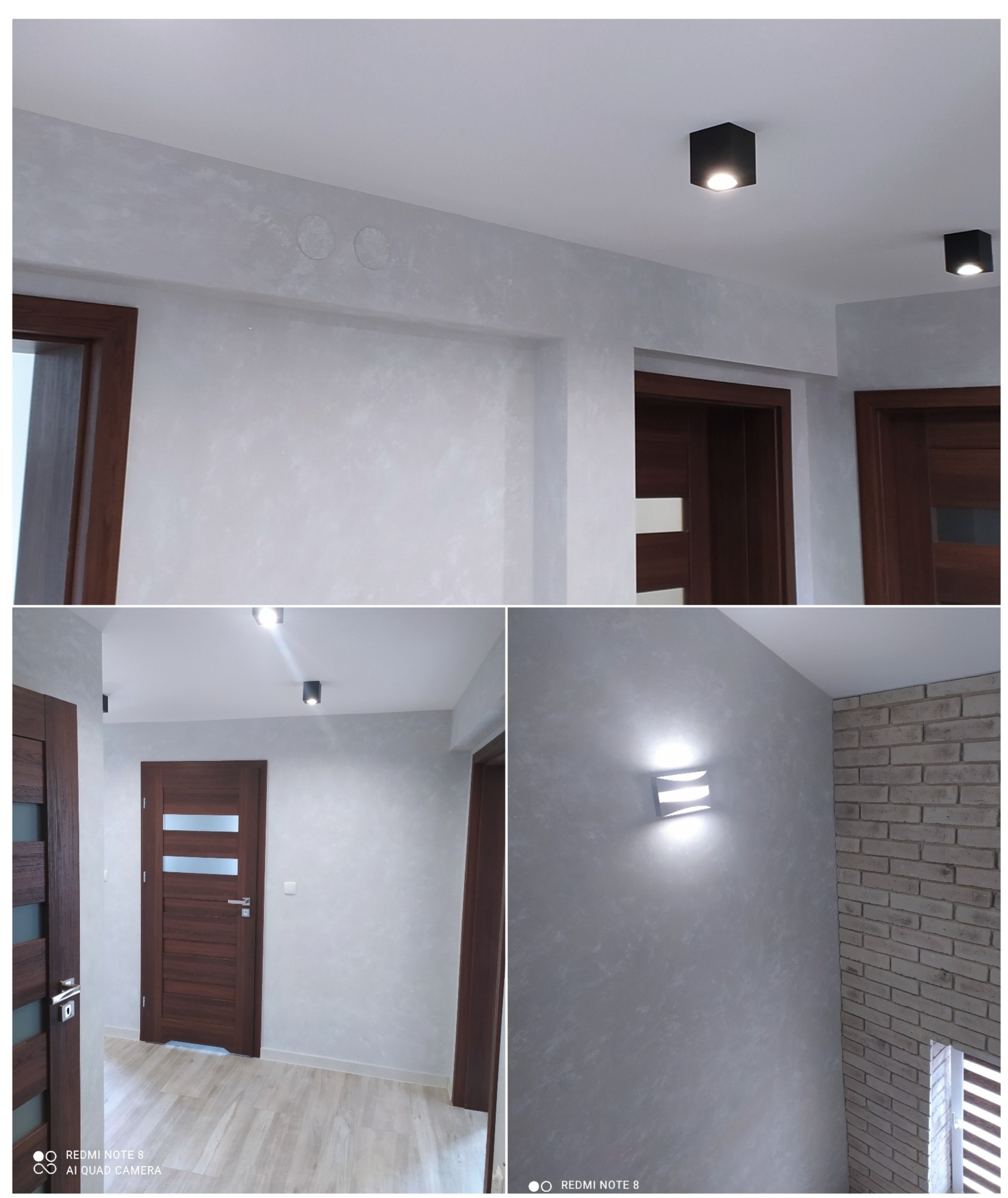 Korytarz po remoncie: ściany pokryte dekoracyjną szarą farbą z efektem chmur, drewniane drzwi z przeszkleniami, czarne lampy sufitowe oraz kinkiet na ścianie z cegły.