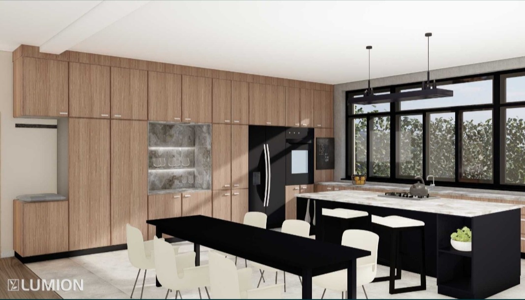 Wizualizacja przestronnej kuchni z zabudową meblową w odcieniach drewna, czarną lodówką i wyspą z białym blatem, oświetloną wiszącymi lampami, z widokiem na zieleń za oknem.