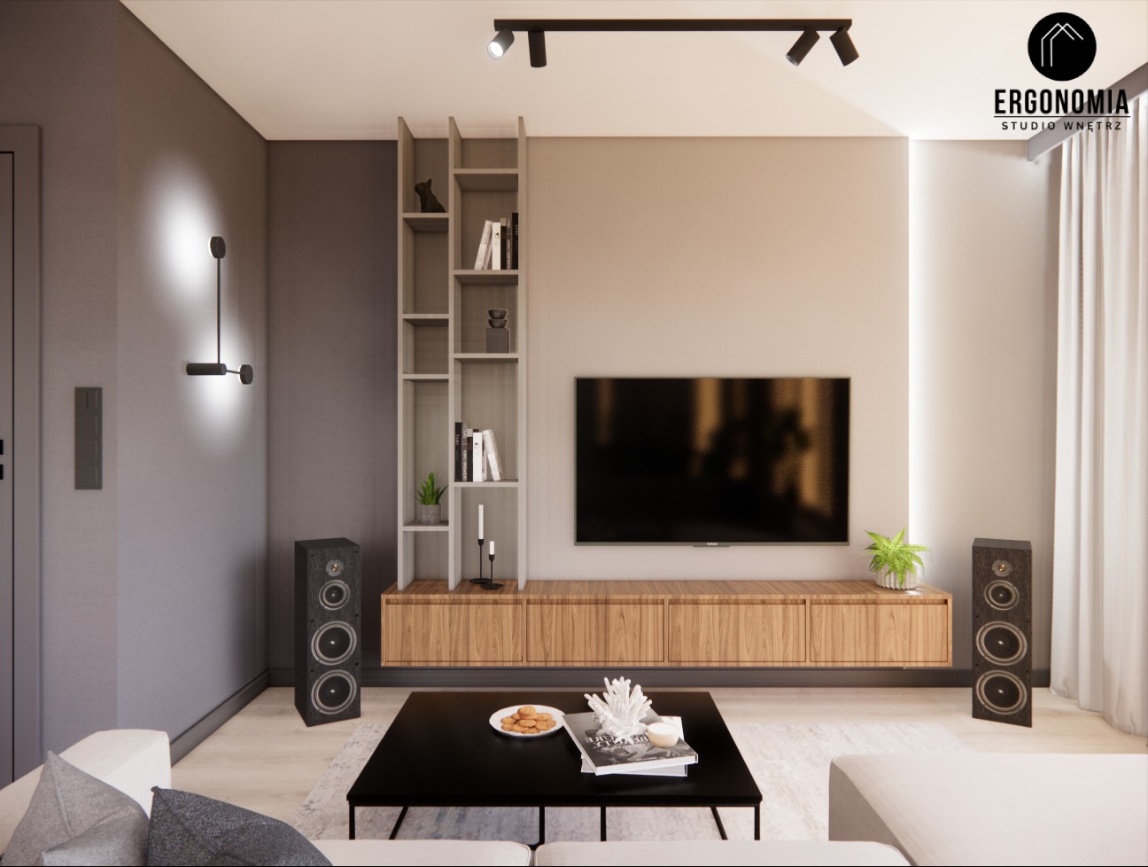 Nowoczesny salon z szarą ścianą, drewnianą szafką RTV, czarnym stolikiem kawowym z dekoracjami, wysokimi głośnikami i oświetleniem punktowym.