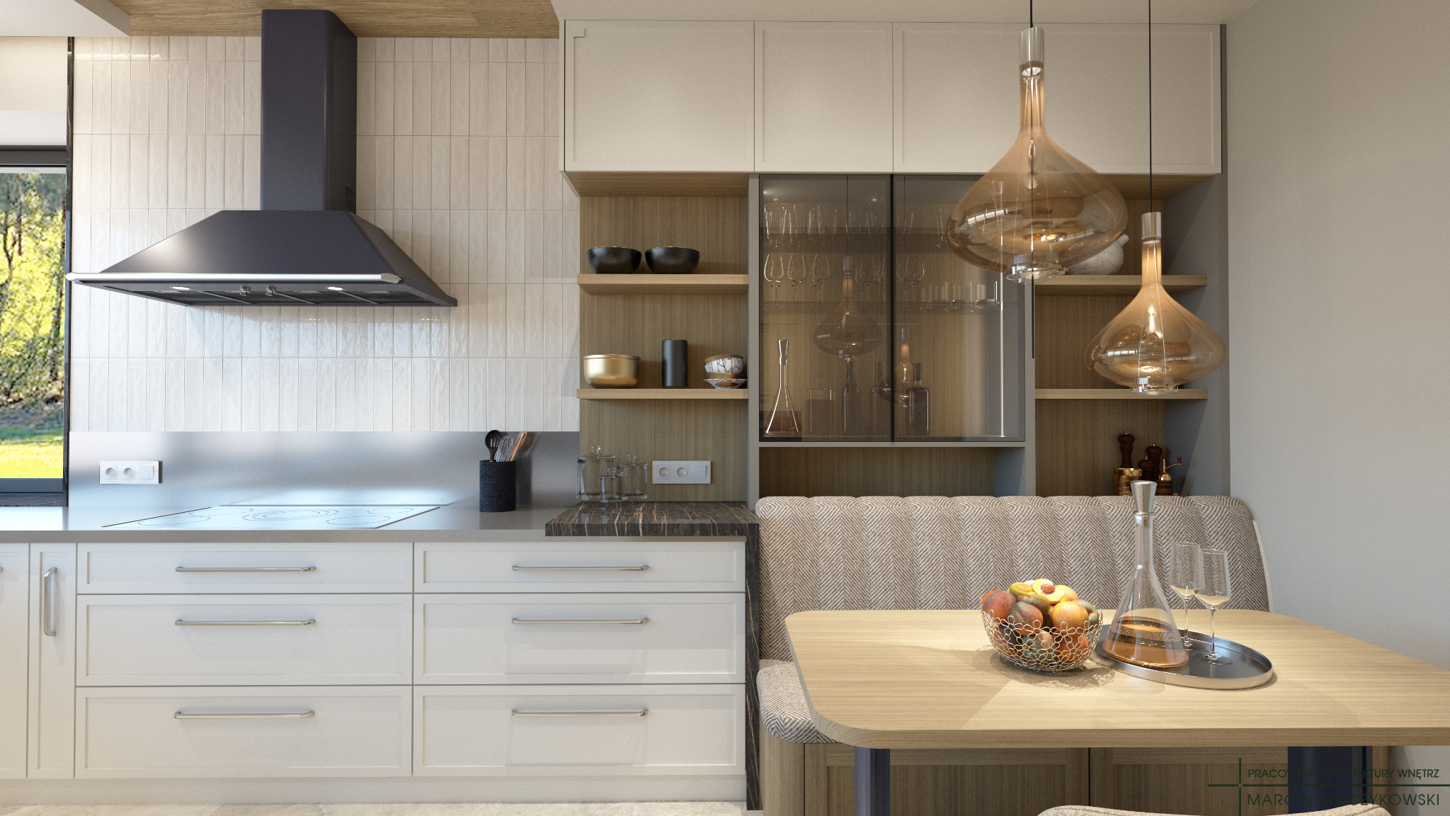 Jasna kuchnia z białymi frontami szafek, szarym okapem i drewnianymi akcentami, uzupełniona o stół z owocami i dekoracyjnymi lampami wiszącymi w kształcie kropli.