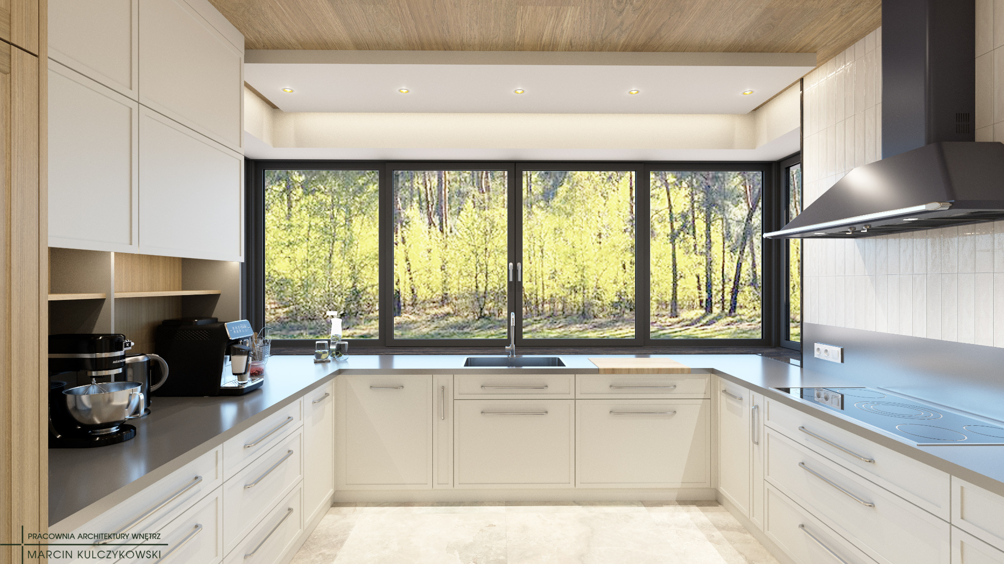 Jasna kuchnia z dużym oknem z widokiem na las, wyposażona w sprzęt AGD, z drewnianym sufitem i białymi płytkami na ścianie.
