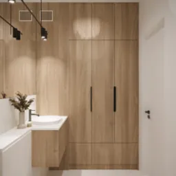 Nowoczesna łazienka w Gdyni z drewnianą zabudową meblową, minimalistyczną umywalką i czarnymi akcentami oświetleniowymi.