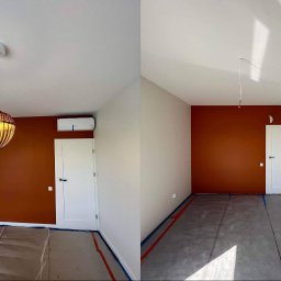 Taras I kompania - Pokój po malowaniu: jedna ściana w kolorze terakoty, druga w jasnym beżu, zabezpieczona podłoga, wisząca lampa z wikliny i klimatyzator na ścianie.