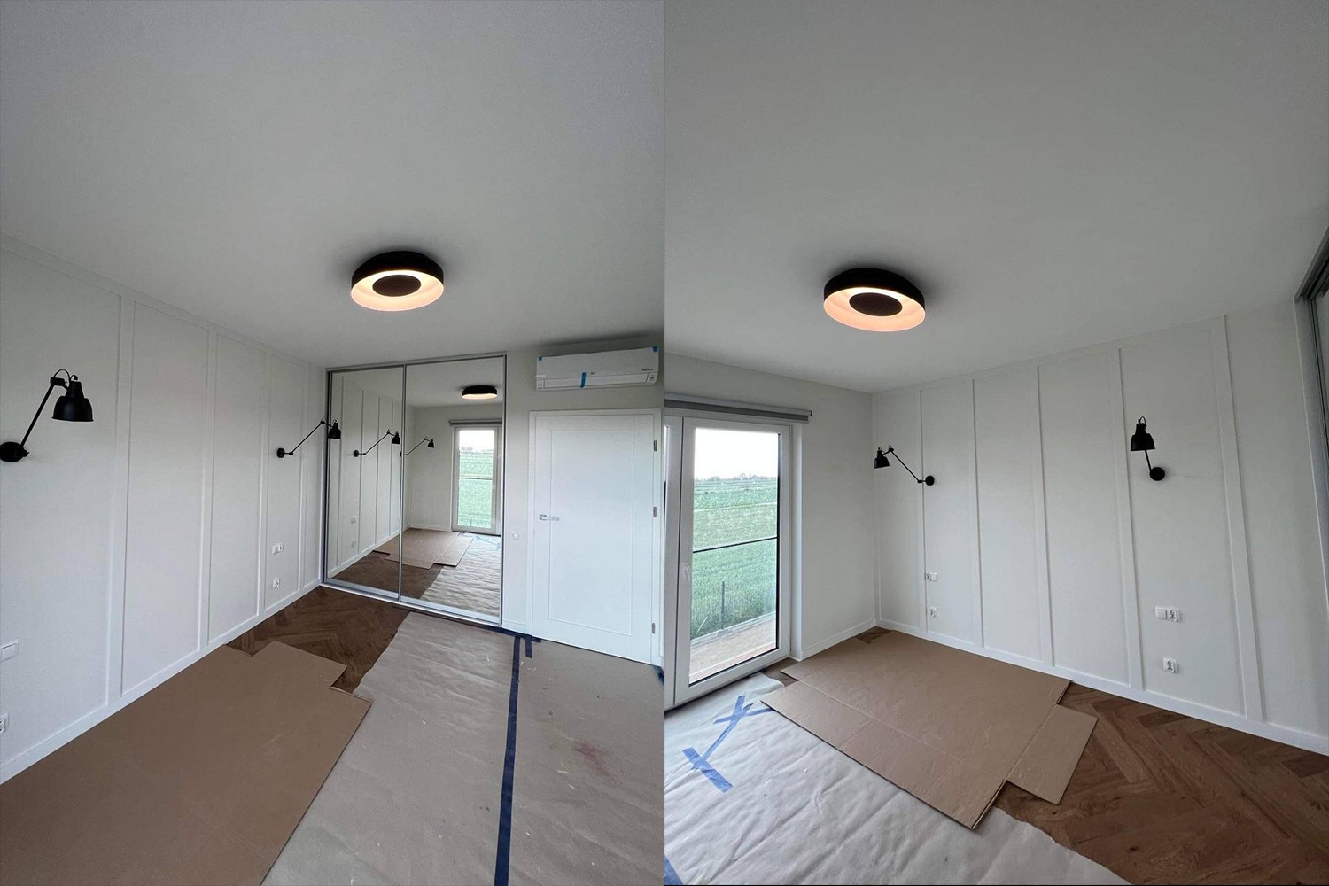 Pokój po odświeżeniu ścian z panelami dekoracyjnymi, częściowo zabezpieczony kartonem i folią malarską, z parkietem w jodełkę, lustrzaną szafą przesuwną i czarnymi lampami ściennymi.