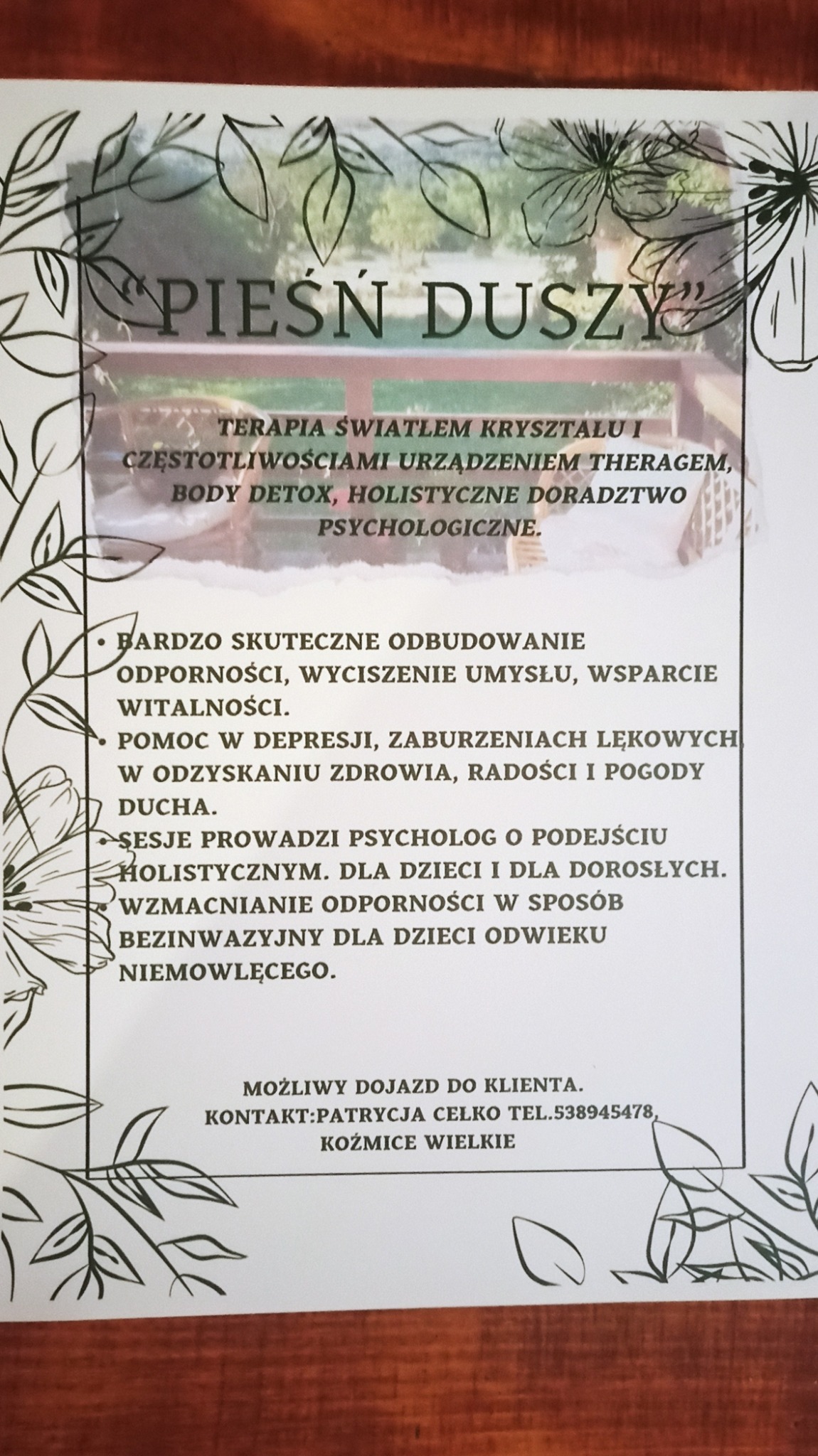Ulotka reklamowa z ofertą terapii światłem kryształu, body detox i holistycznego doradztwa psychologicznego, prowadzonego przez psychologa, z motywem roślinnym w ramce.