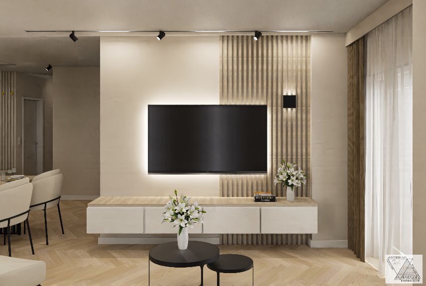 Nowoczesny salon z telewizorem podświetlonym LED, dekoracyjną ścianą z drewnianych paneli pionowych, białym stolikiem RTV, bukietami białych lilii w wazonach, oraz lampami sufitowymi punktowymi...