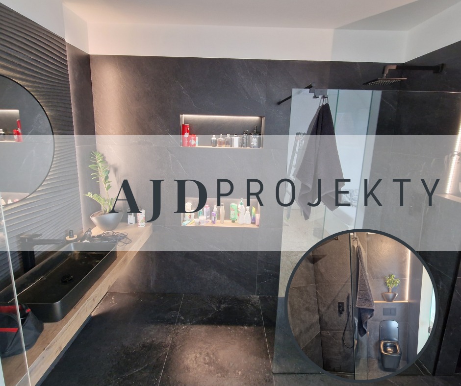 Nowoczesna łazienka w ciemnej tonacji z czarną armaturą, kabiną prysznicową typu walk-in i umywalką nablatową, podświetlane wnęki z kosmetykami i dekoracjami, duże płytki imitujące kamień...