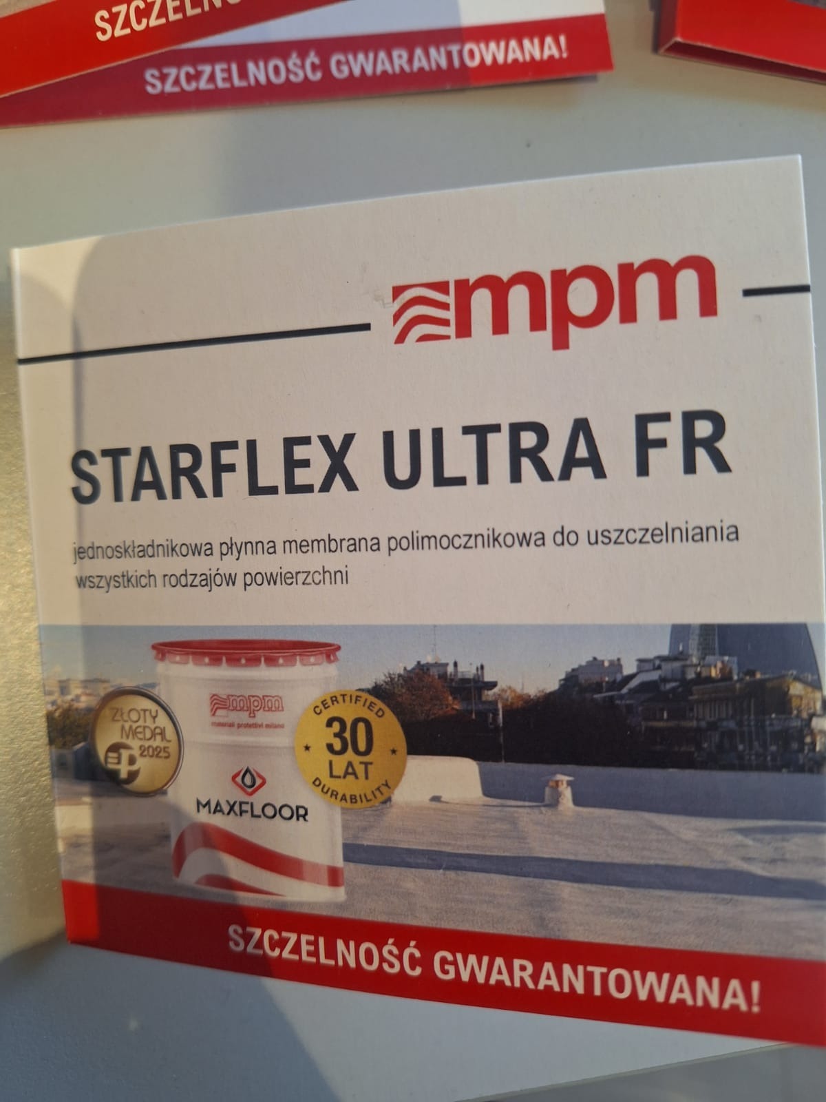 Folder reklamowy membrany polimocznikowej Starflex Ultra FR do uszczelniania powierzchni, z logo MPM, informacją o 30-letniej trwałości i gwarancji szczelności.