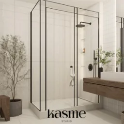 Minimalistyczna łazienka z kabiną prysznicową typu walk-in z czarnymi ramami, drewnianą szafką pod umywalką i roślinami doniczkowymi, wykończona płytkami w jasnym odcieniu.