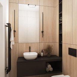 KASME studio - Nowoczesna łazienka z drewnianymi panelami, umywalką nablatową, czarną armaturą i geometryczną podłogą. Minimalistyczne oświetlenie i dekoracje.