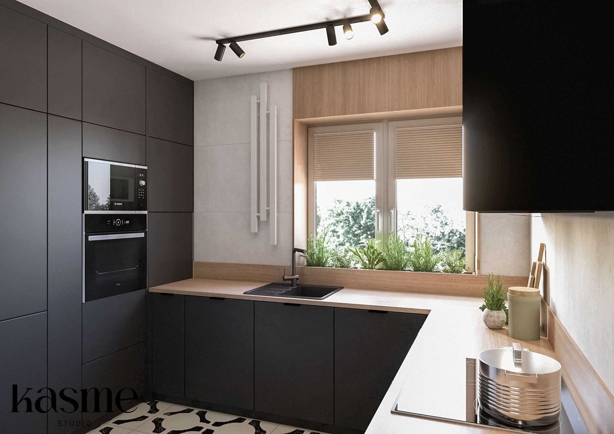 Nowoczesna kuchnia z ciemnymi, matowymi szafkami, drewnianym blatem, oknem z roletami i ziołami, oświetleniem szynowym oraz dekoracyjnymi elementami ściennymi.