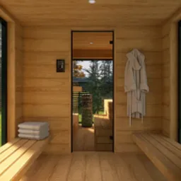 Wnętrze drewnianej sauny z widokiem na zewnątrz przez przeszklone ściany, z ręcznikami na ławce i szlafrokiem na ścianie.