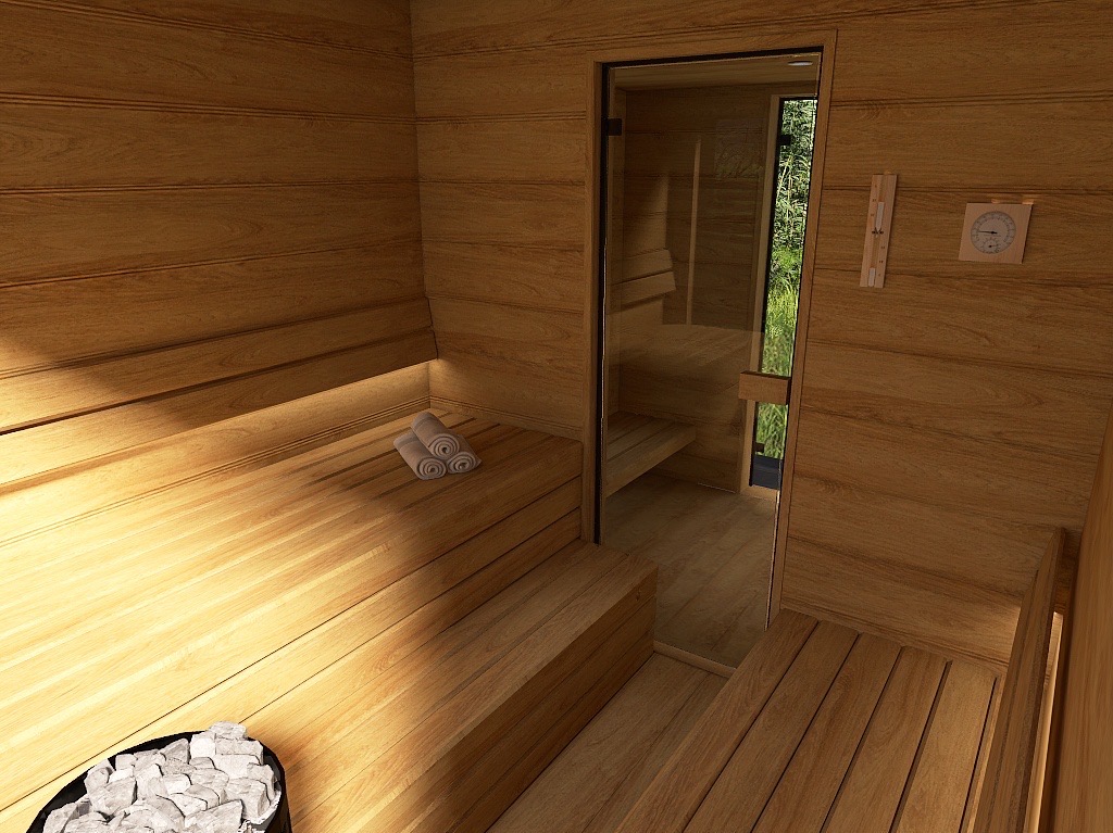 Wnętrze sauny wykończone drewnem z przeszklonymi drzwiami, widoczne kamienie do pieca i zwinięte ręczniki na ławie.