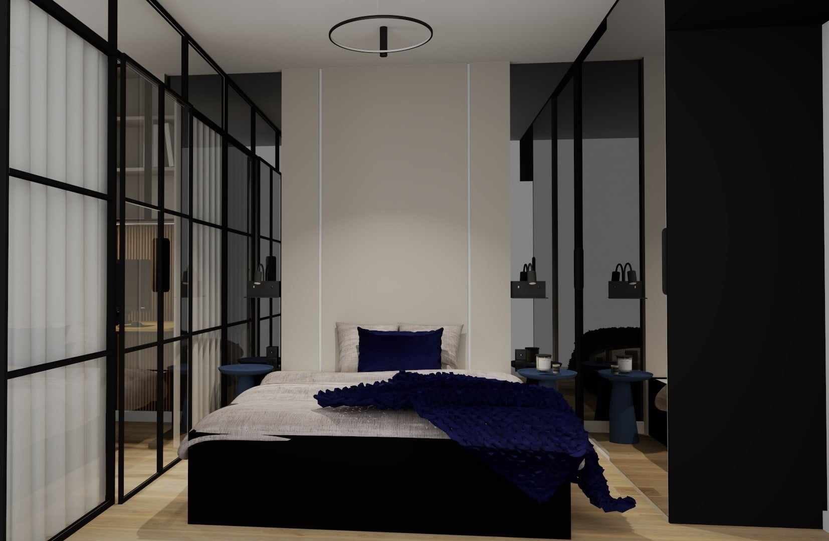 Nowoczesna sypialnia z czarną ramą szklaną, beżową ścianą, granatową narzutą i okrągłą lampą sufitową.