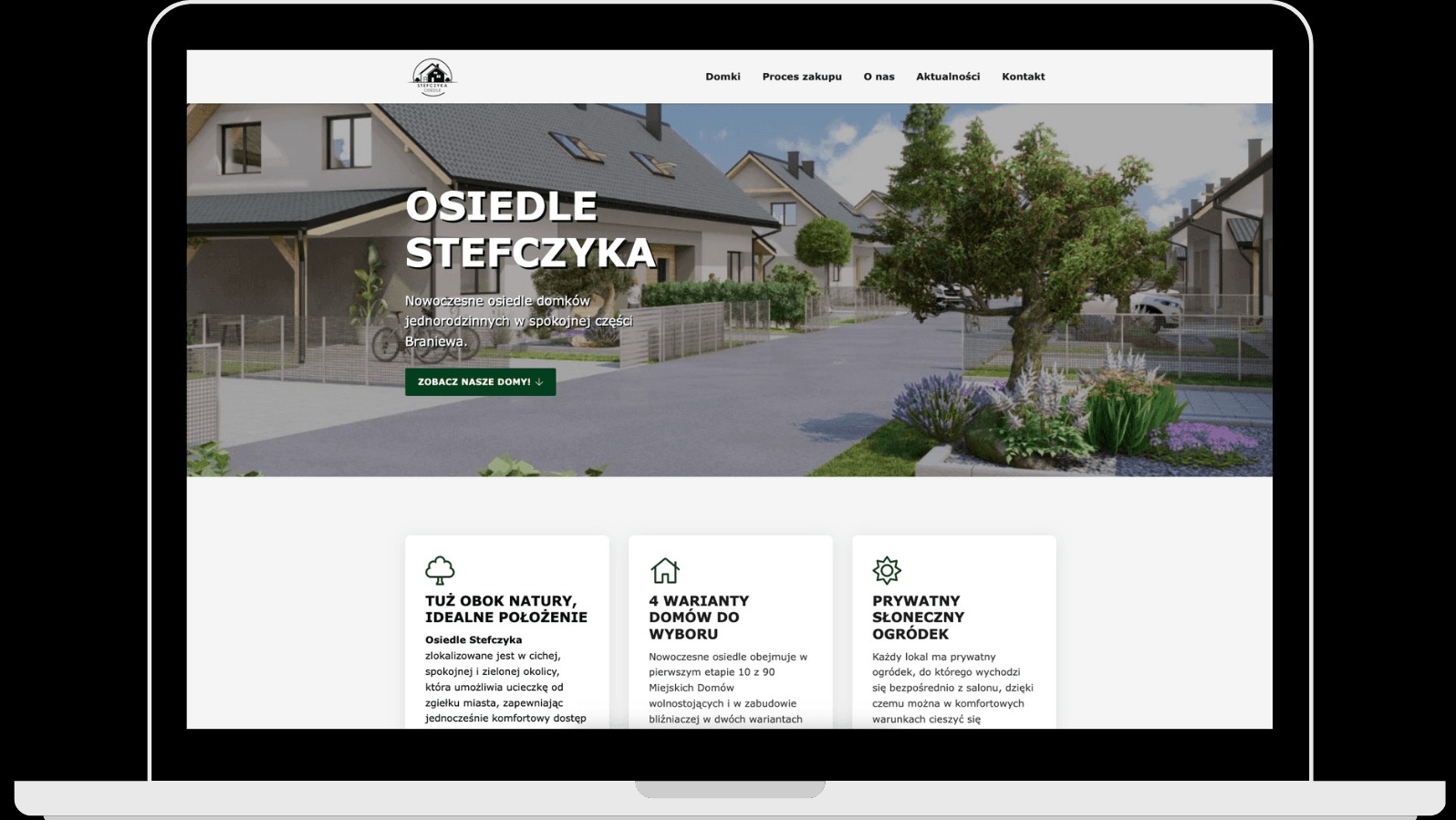 Ekran laptopa prezentuje stronę www osiedla Stefczyka w Braniewie. Widok z perspektywy użytkownika, nawigacja u góry, domy i zieleń w tle, sekcje informacyjne na dole.