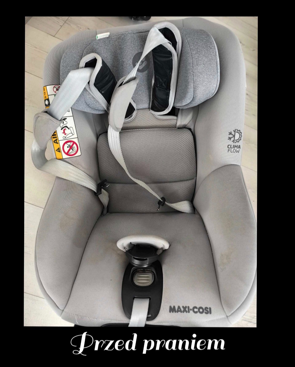 Szare fotelik samochodowy Maxi-Cosi z widocznymi plamami przed czyszczeniem, ukazujący stopień zabrudzenia tapicerki.
