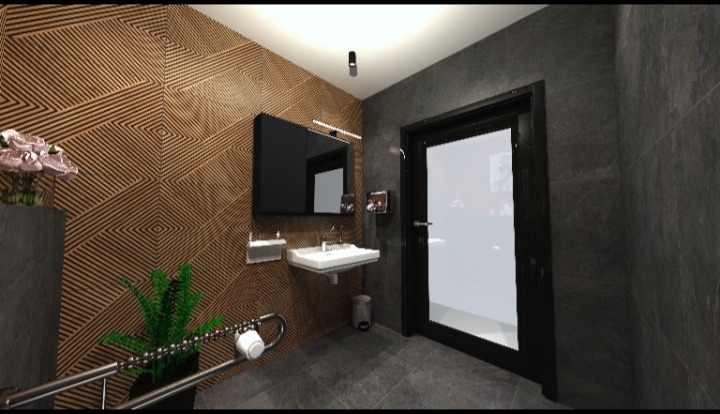 Nowoczesna łazienka z drewnianą ścianą o geometrycznym wzorze, umywalką i dużym lustrem. Minimalistyczny design z roślinami i szarymi płytkami.