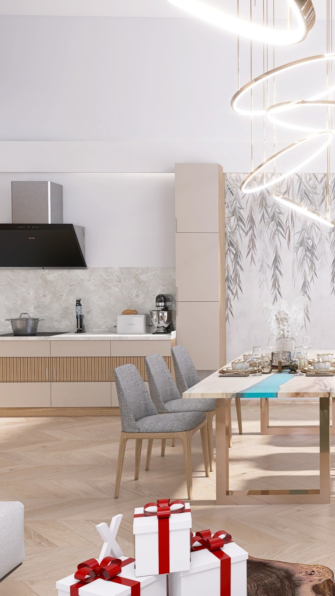 Nowoczesna kuchnia z jadalnią w neutralnej kolorystyce, stół z żywicą epoksydową, dekoracyjne oświetlenie i tapeta z motywem roślinnym, prezenty pod stołem.