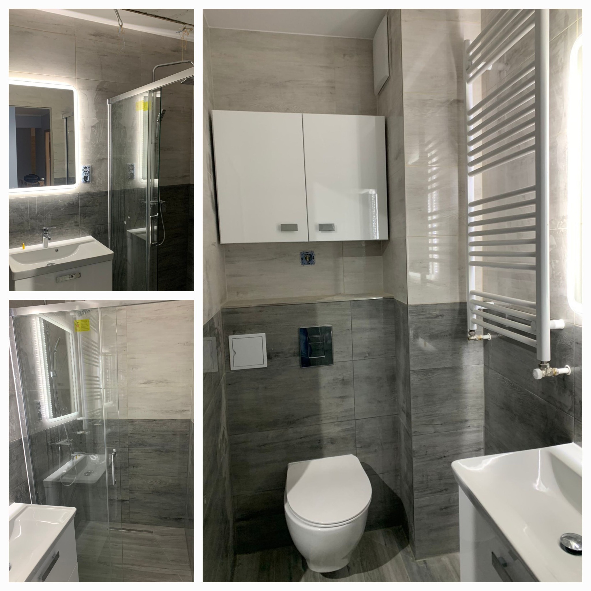 Wykończona łazienka z szarymi płytkami imitującymi drewno, kabiną prysznicową ze szklanymi drzwiami, podświetlanym lustrem, białą szafką nad toaletą i grzejnikiem drabinkowym.