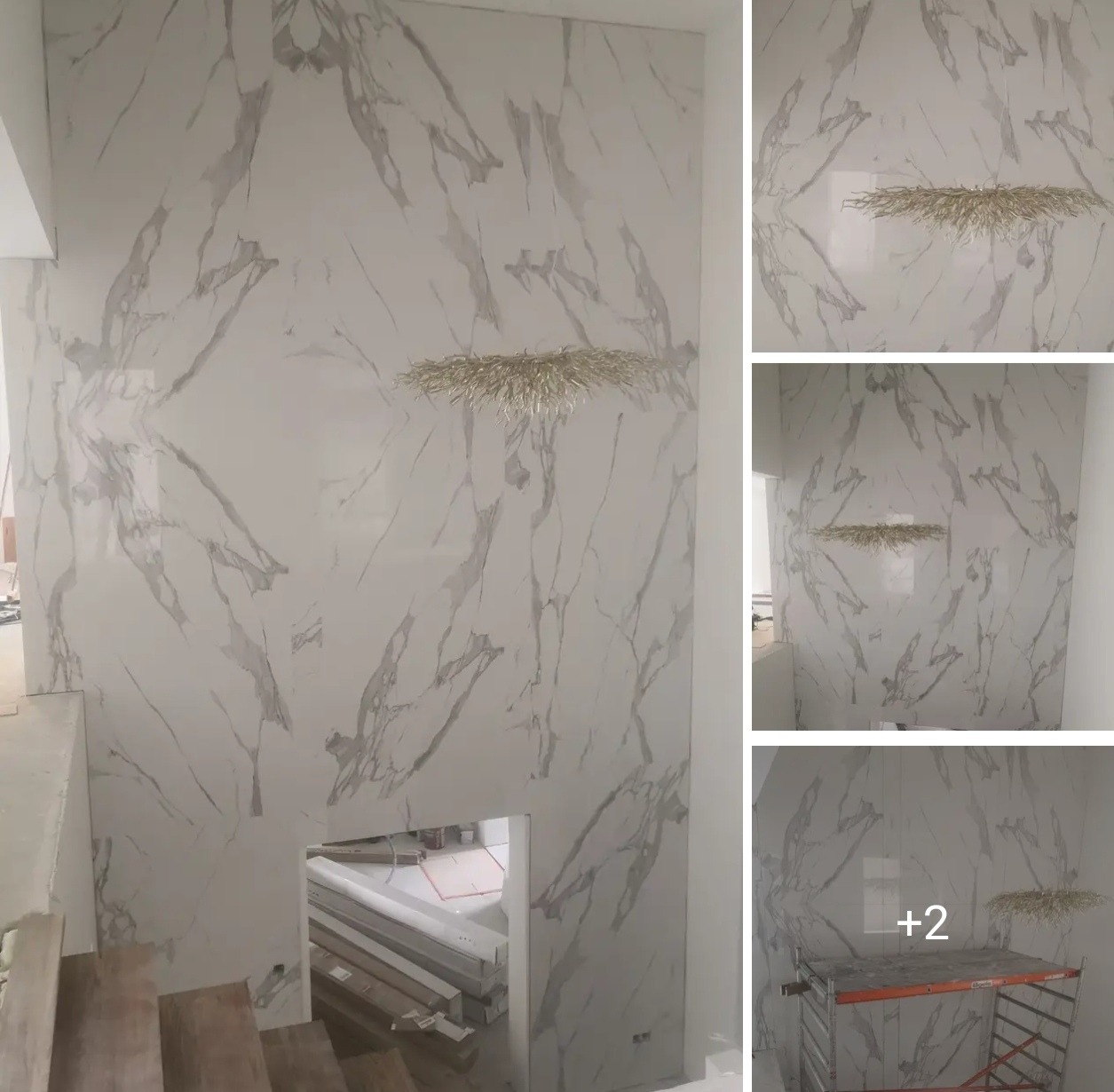 Ściana wykończona płytami imitującymi marmur Carrara, z dekoracyjną lampą. Widoczne schody i fragment rusztowania. Całość w jasnej tonacji.