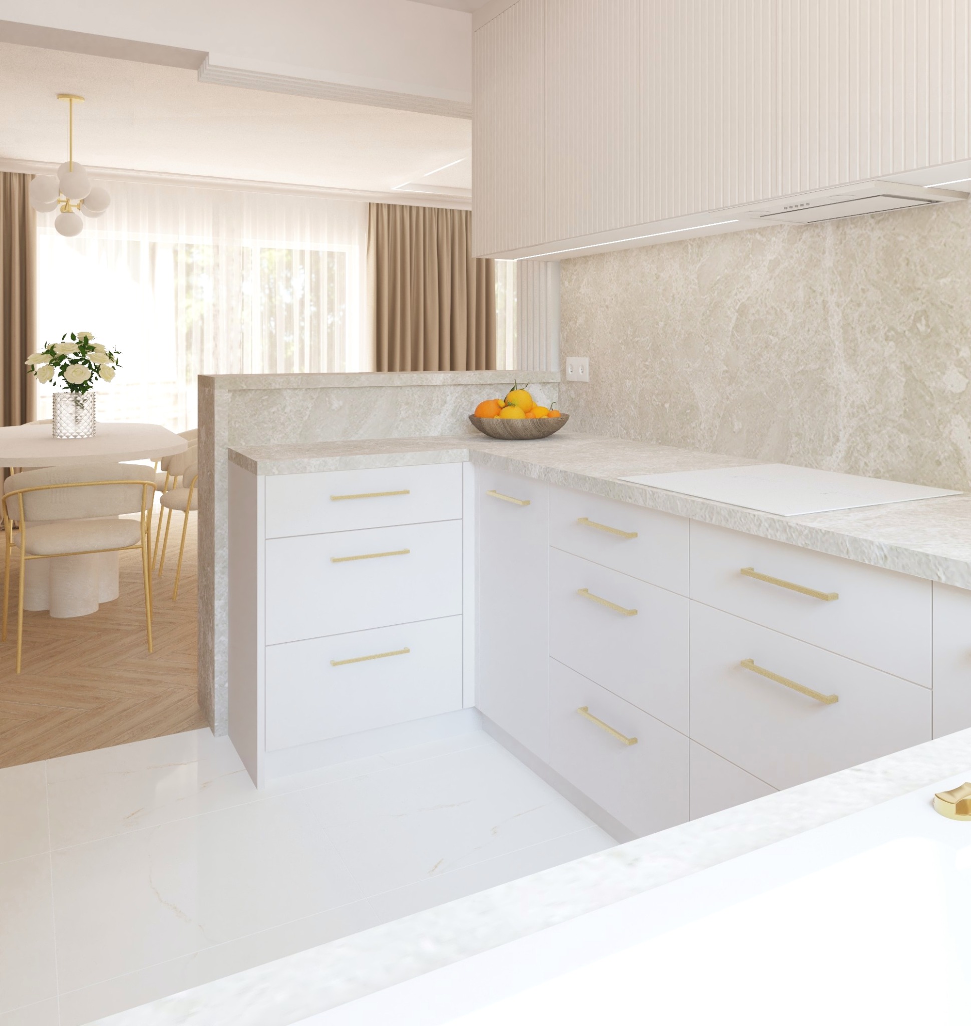 Jasna kuchnia z białymi szafkami i złotymi uchwytami. Na blacie misa z owocami. W tle jadalnia z okrągłym stołem i krzesłami. Nowoczesny design.