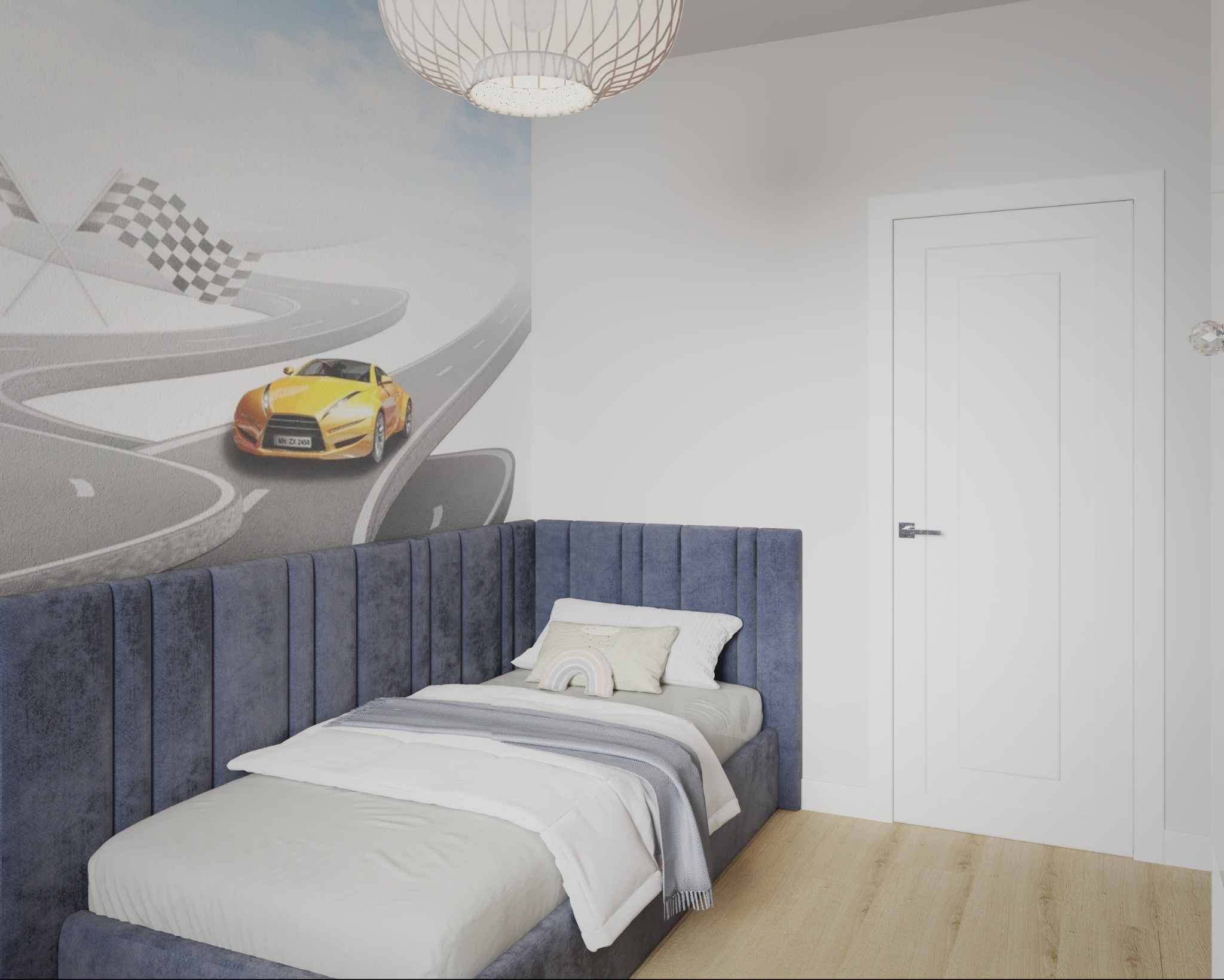 Pokój dziecięcy z łóżkiem i tapetą z motywem wyścigowym w Wieczfni Kościelnej. Niebieskie obicie łóżka, biała pościel i lampa sufitowa.