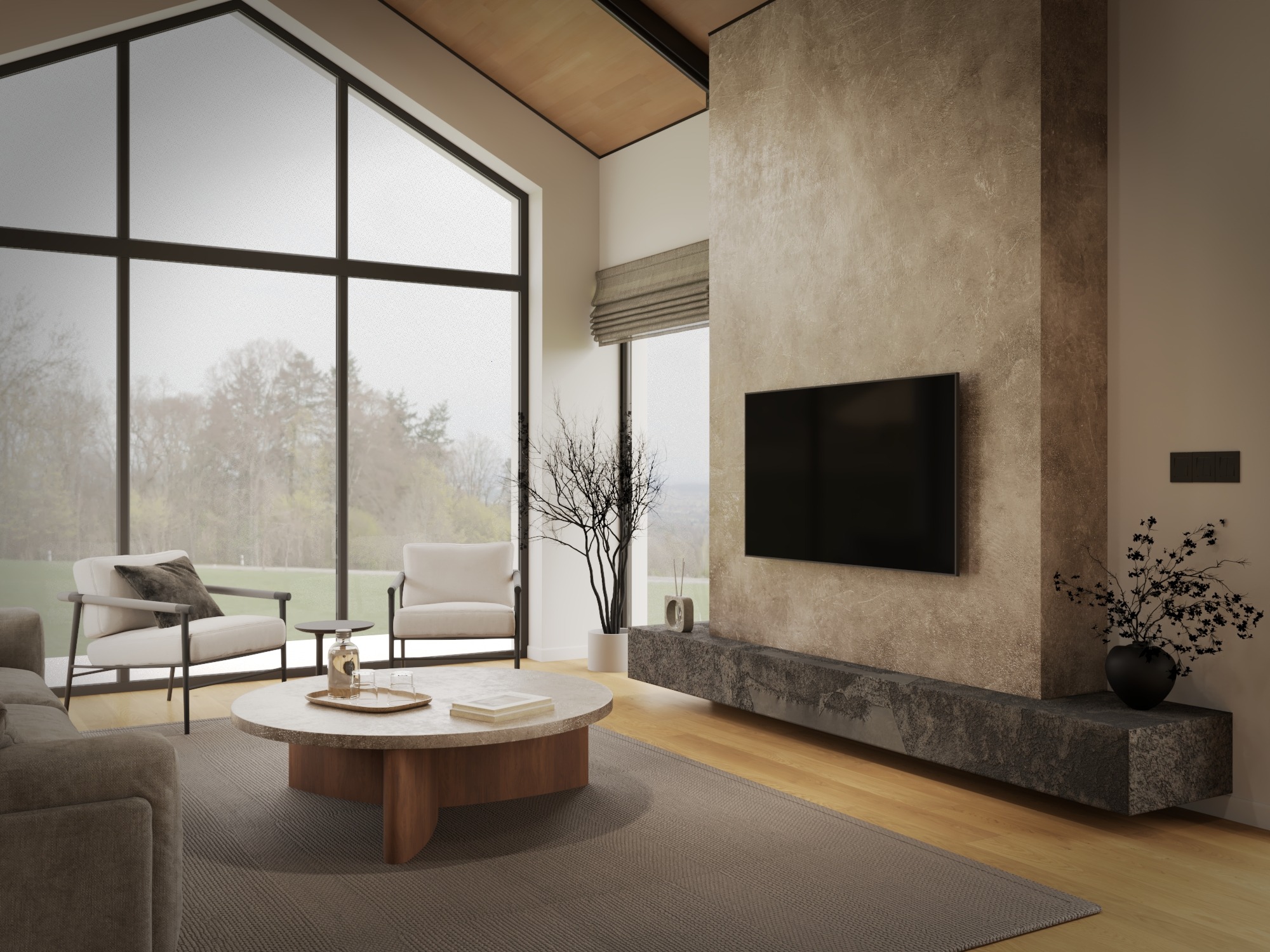 Jasny salon z dużym oknem i minimalistycznym wystrojem. Centralnie okrągły stolik kawowy, szara sofa i dwa białe fotele. Na ścianie telewizor i dekoracyjny panel.