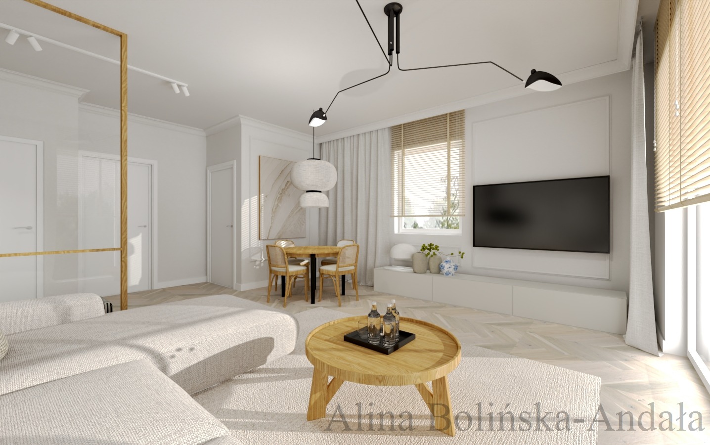 Jasne, nowoczesne wnętrze salonu z drewnianym stolikiem kawowym, beżową sofą narożną, okrągłym stołem jadalnym z krzesłami z rattanu, białymi ścianami, parkietem w jodełkę i czarną lampą sufitową.