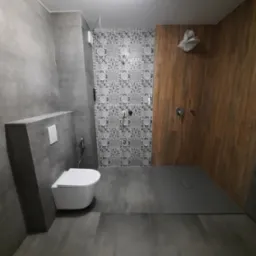 Nowoczesna łazienka z szarymi płytkami, kabiną prysznicową wykończoną drewnem i wzorzystymi płytkami. Wisząca toaleta. Minimalistyczny design.