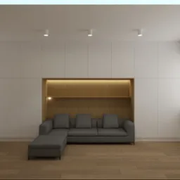 Minimalistyczny salon: zabudowa meblowa z wnęką oświetloną ciepłym światłem, w której umieszczono szarą sofę z szezlongiem, drewniana podłoga.