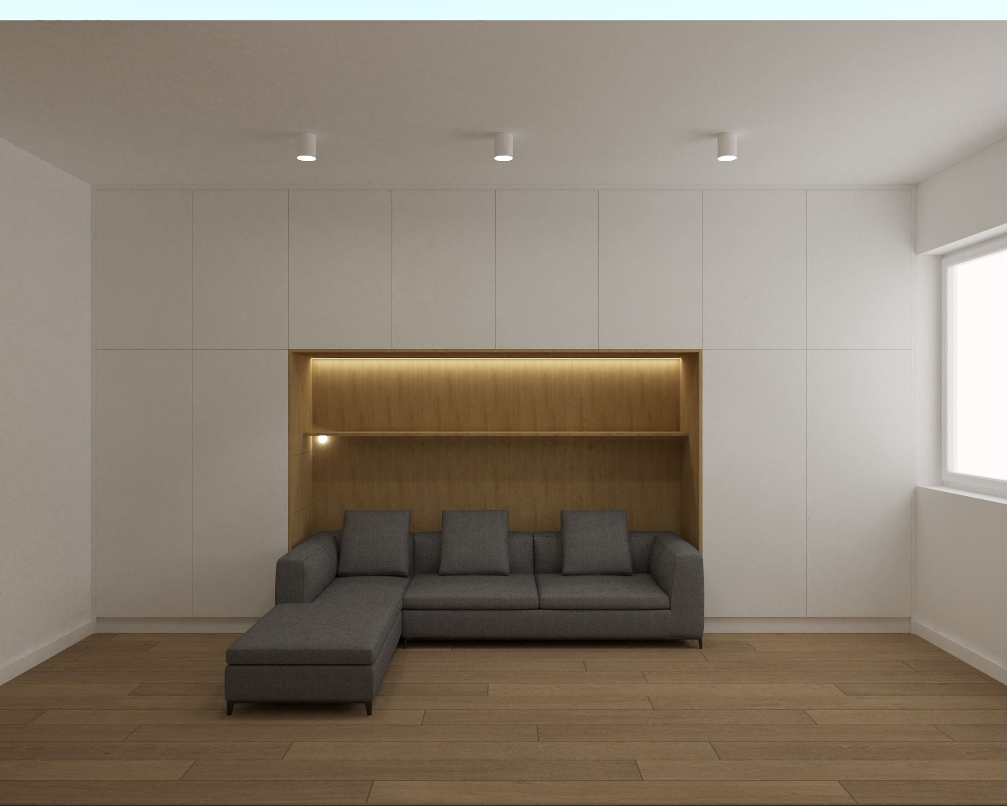 Minimalistyczny salon: zabudowa meblowa z wnęką oświetloną ciepłym światłem, w której umieszczono szarą sofę z szezlongiem, drewniana podłoga.