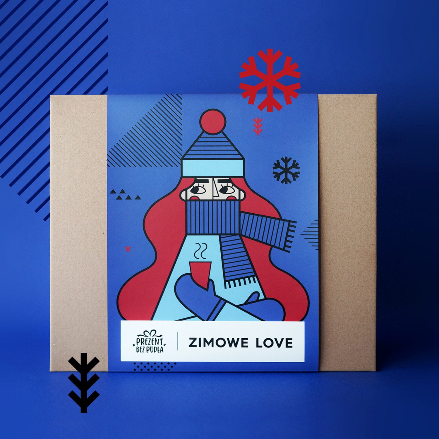 Grafika identyfikacji wizualnej na opakowaniu prezentowym z motywem zimowym: postać w czapce i szaliku, trzymająca kubek, na niebieskim tle z dekoracyjnymi śnieżynkami i geometrycznymi wzorami.