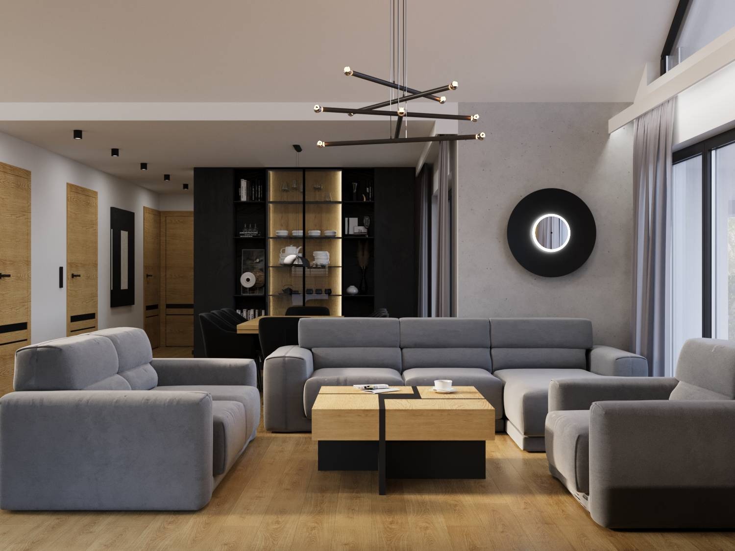 Nowoczesny salon z szarą sofą narożną, drewnianym stolikiem kawowym i okrągłym, podświetlanym lustrem na betonowej ścianie. Minimalistyczne oświetlenie i drewniana podłoga.