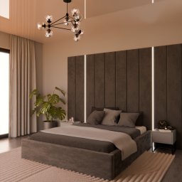 F.H.U. ADAMS MEBLE PIOTR ADAMSKI - Nowoczesna sypialnia z łóżkiem kontynentalnym, panelem tapicerowanym z podświetleniem LED, designerską lampą sufitową i puszystym dywanem z geometrycznym wzorem.