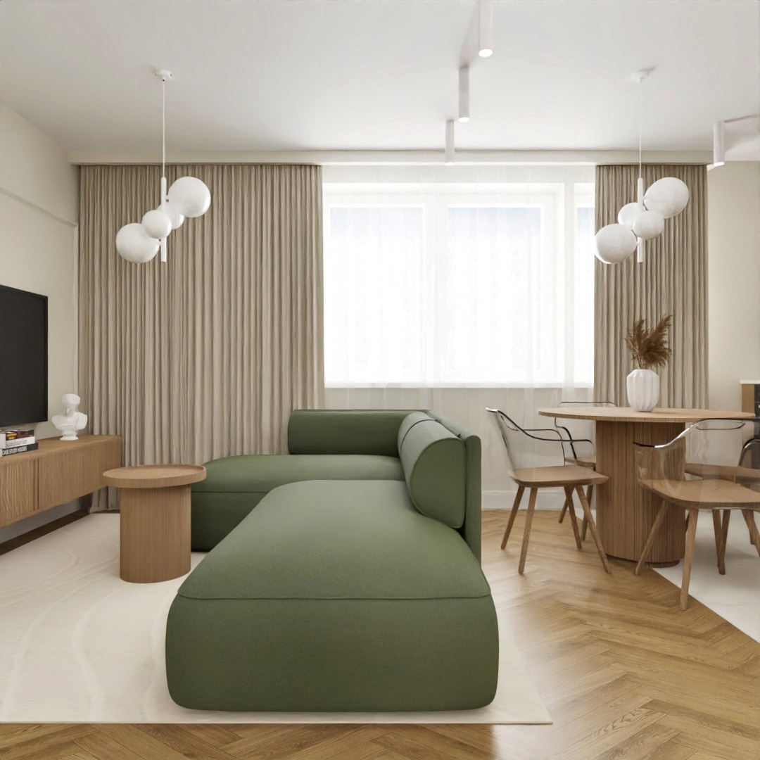 Nowoczesny salon z zieloną sofą narożną, okrągłym drewnianym stołem i transparentnymi krzesłami, podwieszanymi lampami kulami oraz parkietem w jodełkę.