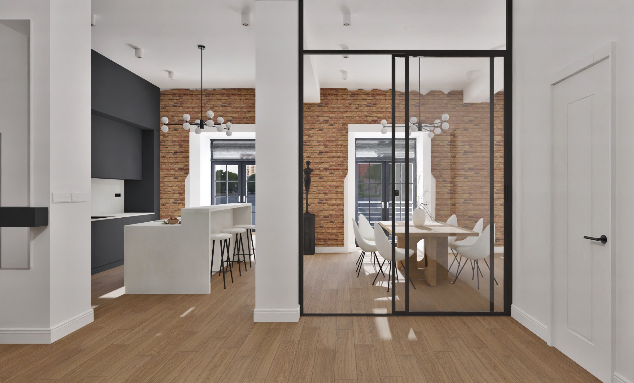Nowoczesne wnętrze: kuchnia z wyspą i jadalnia oddzielona szklaną ścianą, ceglana ściana, drewniana podłoga, minimalistyczne oświetlenie.