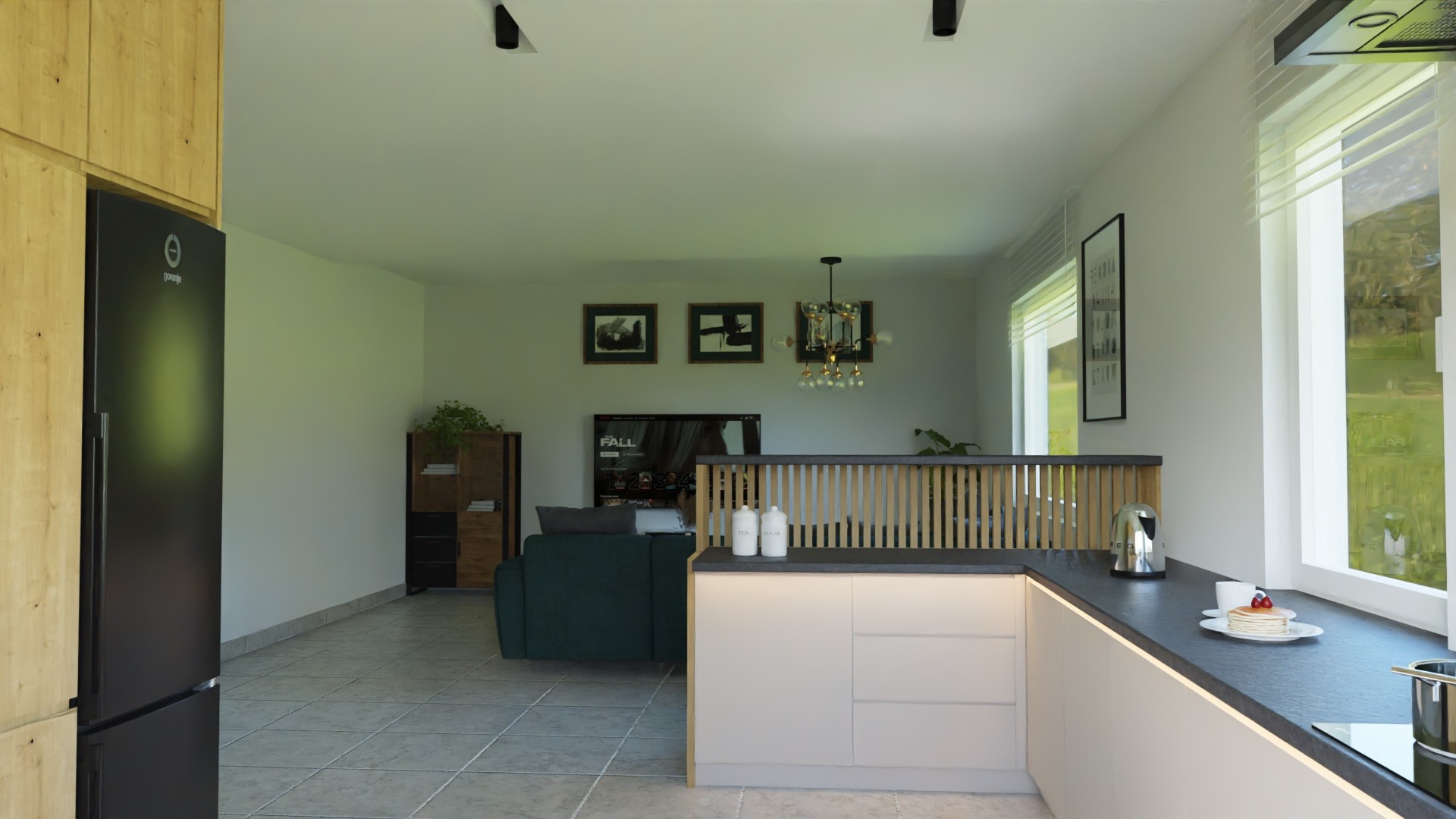 Wnętrze mieszkania: kuchnia z wyspą oddzieloną drewnianą ażurową ścianką od salonu z zieloną sofą, czarną lodówką i telewizorem w tle.