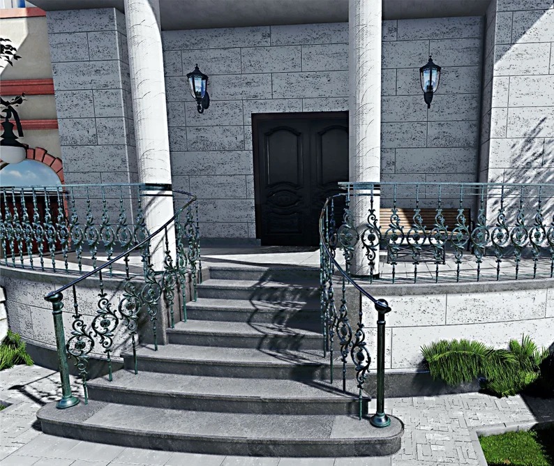 Kute, dekoracyjne poręcze schodowe w kolorze patynowanej zieleni, prowadzące do wejścia budynku z kamienia. Na schodach widoczne cienie.