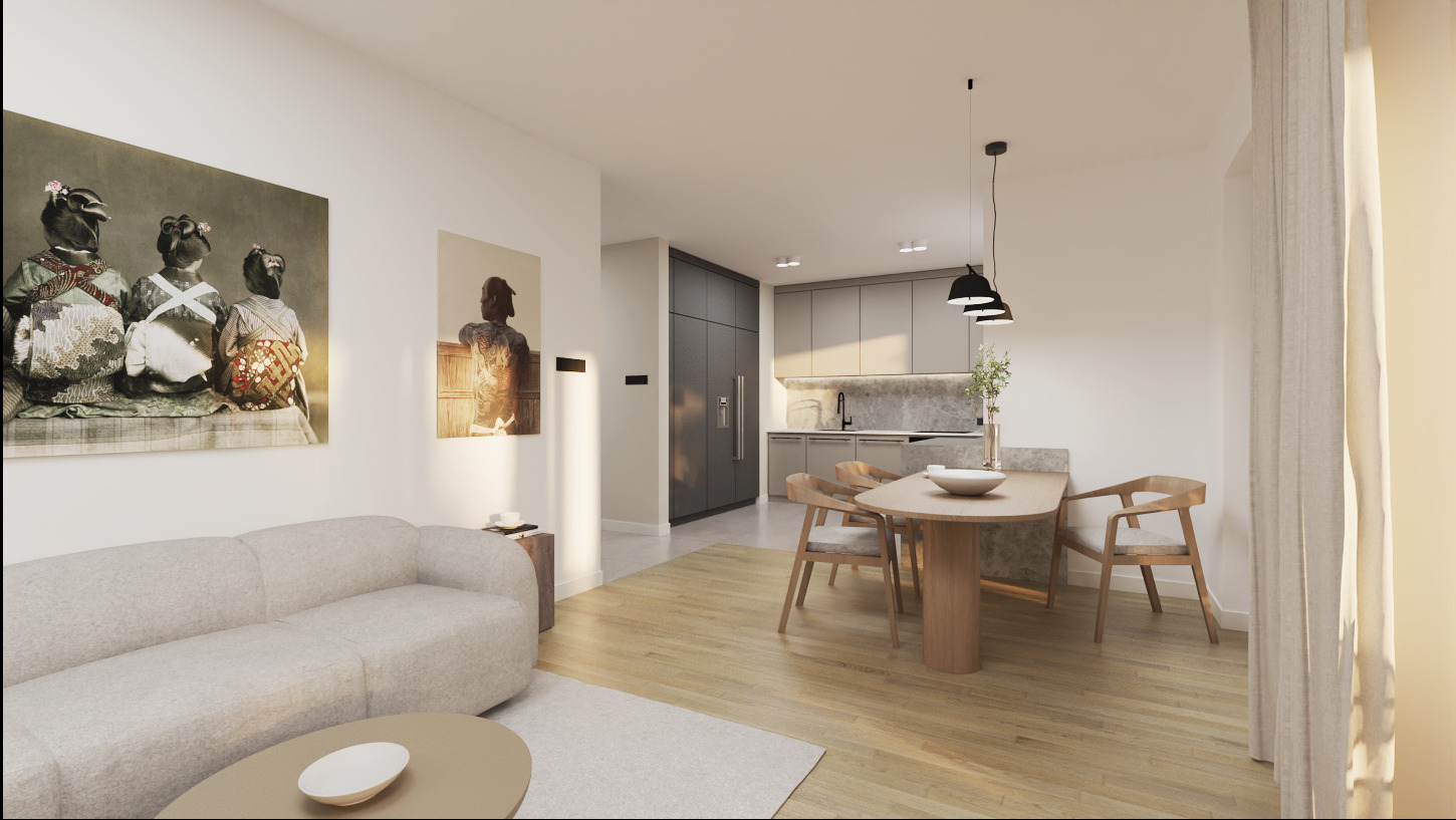 Jasne wnętrze mieszkania z drewnianą podłogą, szarą sofą i stołem jadalnym, ozdobione obrazami na ścianach, z widokiem na kuchnię w tle.