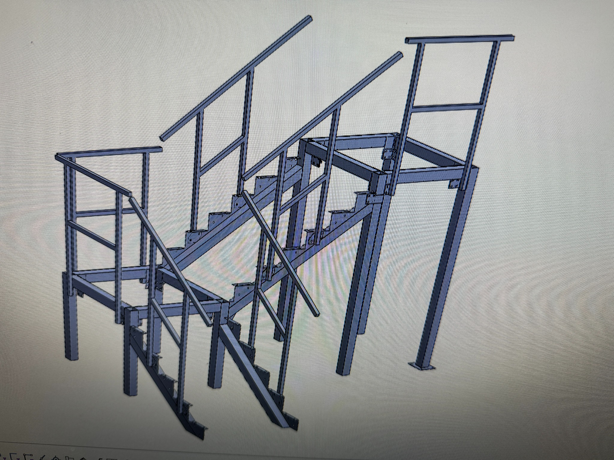 Model 3D konstrukcji schodów metalowych z balustradami, widok z boku, surowy metal, brak wykończenia.