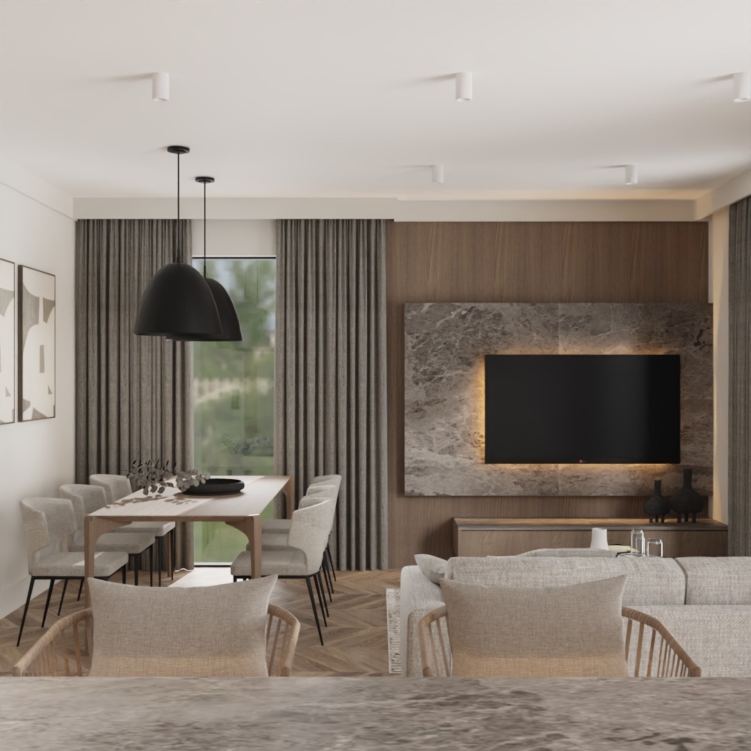 Wnętrze salonu z jadalnią w neutralnych barwach: stół z krzesłami, sofa, telewizor na ścianie z marmurowym wykończeniem, zasłony w kolorze taupe, oświetlenie punktowe i lampy wiszące.